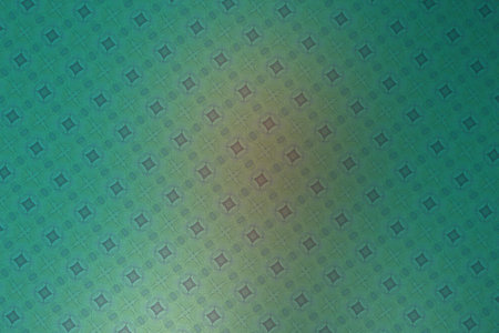 abstract background with a pattern of rhombuses in green and blue