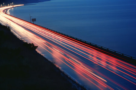Car light trails on the road at night. Long exposure photo.の素材