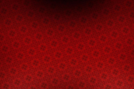 red abstract background with some shades and highlights on it and a patternの写真素材