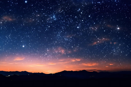 Beautiful night sky with stars and the silhouette of the mountains.の素材