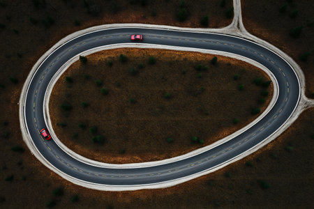 Aerial view of a winding road in the countryside.の素材