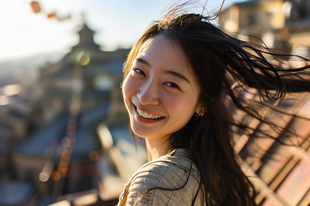 Portrait of a beautiful young asian woman smiling at the cameraの素材
