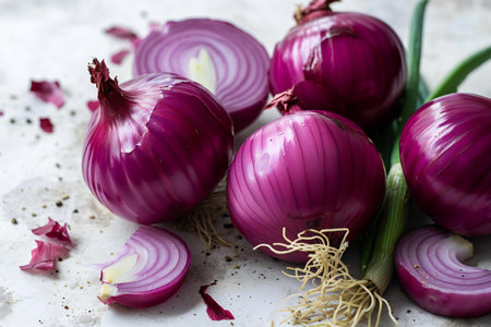 red onions on a white background. tinting. selective focus on the middle onionの素材