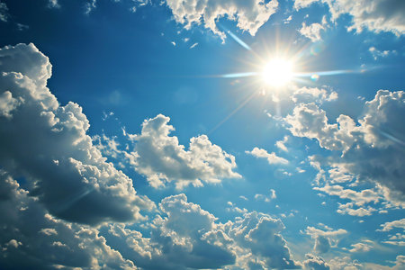 Blue sky background with tiny clouds and sun. Natural summer background.の素材