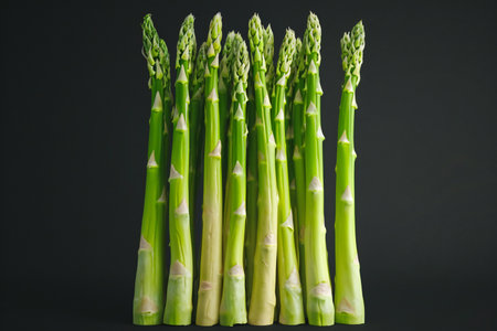 Green asparagus on black background. Studio shot. Healthy food.の素材