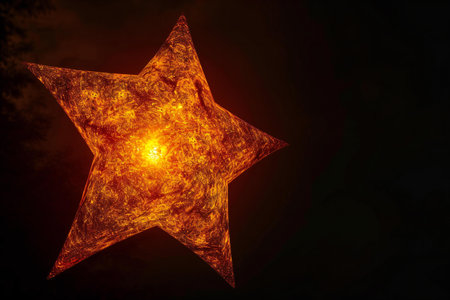 Fiery star on dark background.の素材
