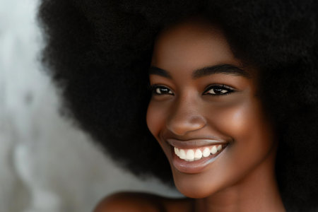 Beautiful african american young woman with afro hairstyleの素材