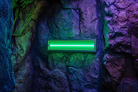 Green neon light in a dark underground cave.の素材