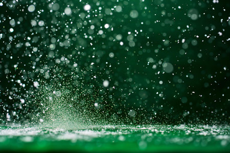 abstract green background with bokeh defocused lights and starsの素材