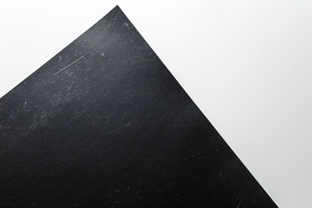 black stone on a white background, closeup of photo with soft focusの素材