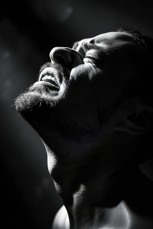 Portrait of a brutal man with a beard on a dark background.の素材