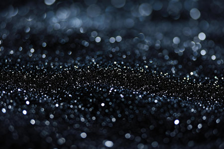 black glitter vintage lights background. silver and black. de-focusedの素材