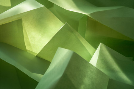 abstract green origami paper background with light and shadow, paper textureの素材