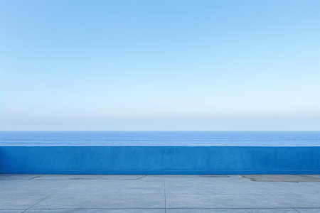 empty concrete floor with blue sea and blue sky background, copy spaceの素材