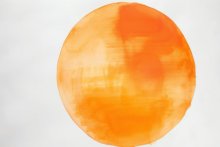 Orange watercolor painted on white paper. Abstract background for design.の素材