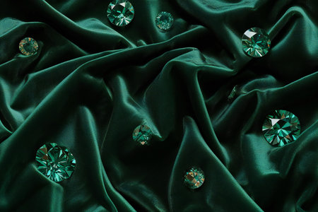 Green satin background with diamonds. Top view. Flat lay.の素材