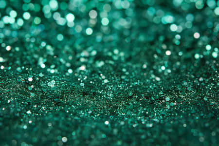 green glitter christmas abstract background. defocused bokeh lightsの素材