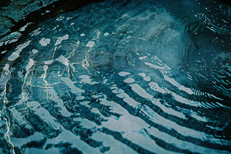 abstract background of water ripples on the surface of the poolの素材