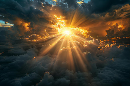Aerial view of beautiful sunset above the clouds with rays of lightの写真素材