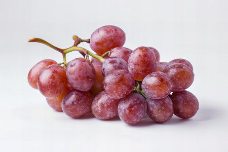 Bunch of red grapes isolated on white background. Close up.
