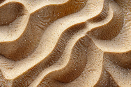 Closeup of wavy sand pattern. Abstract background and texture for design.