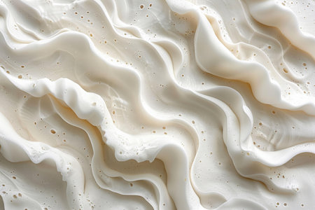 close up of white whipped cream texture on white background, top view