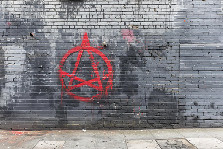 Old brick wall with graffiti. Street art concept. Abstract background.の写真素材