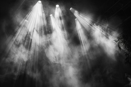 Stage lights on a dark background with smoke. Black and white.の写真素材
