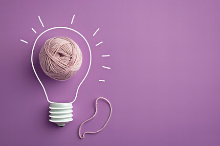 Light bulb with ball of yarn on color background, idea and creativity concept