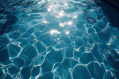 Blue rippled water surface with sun reflections. Abstract background.