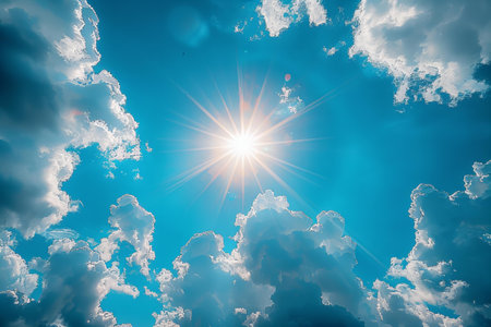 Sunny sky with clouds and sunbeams. Nature background.