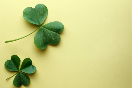 four-leaf clover on a yellow background with space for text
