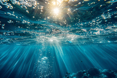 Underwater view of the coral reef with sunbeamsの写真素材