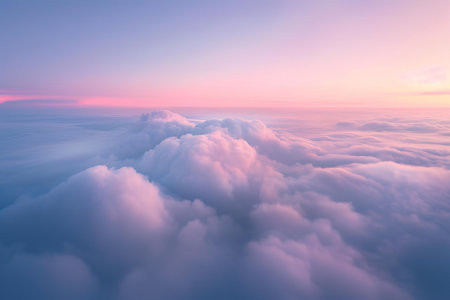 Beautiful aerial view above clouds at sunset. View from airplane window