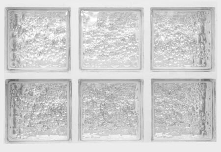 Horizontal isolated reveal clear transparent square bathroom glass block cube and stall window panel rough texture and circle bubble pattern. Arrange in six grids box. Use for object and material.の写真素材