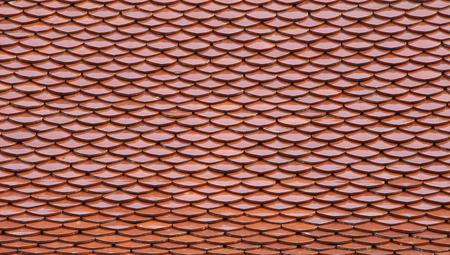 Red tiles roof in temple Bangkok, Thailand, architecture background.の写真素材