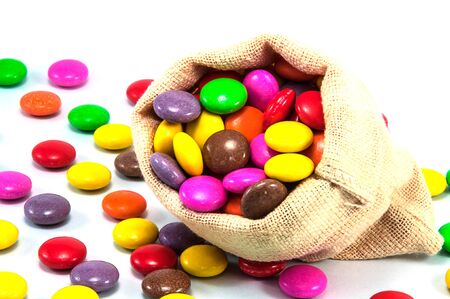 chocolate candy in mini sack bag on white backgroundの写真素材