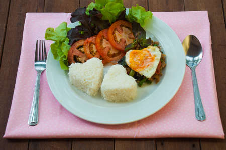 Rice topped with stir-fried pork and basil with egg, Thai styleの写真素材