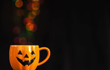 Halloween cup with colorful bokeh for background useの写真素材