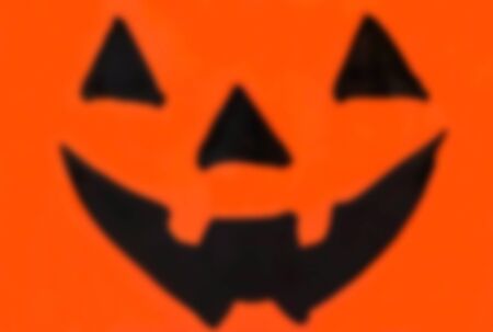 Blurred Halloween Jack O Lantern face for background useの写真素材