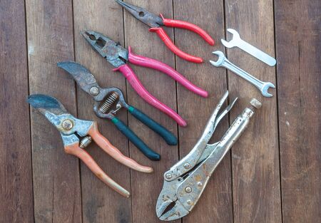 Hand tools over wooden floor