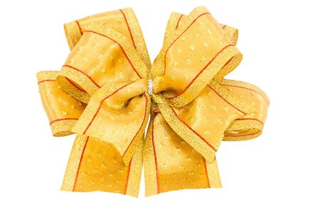 Golden gift bow. Ribbon. Isolated on white backgroundの写真素材