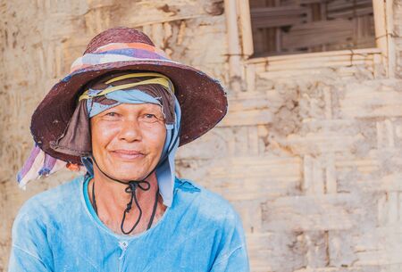Portrait of old Thai farmer in a rural area of Intakin sub-district, Mae Taeng district, Chiang Mai province, Thailand. Photo is taken on 26 DEC 2015, focusing at his face.のeditorial素材