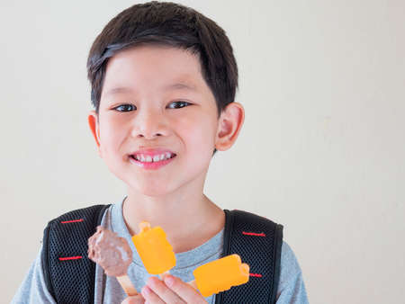 Boy eating ice cream. Photo is focused at his eyes.