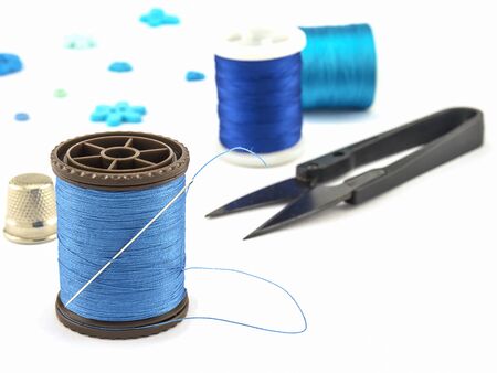 Blue embroidery set over white backgroundの写真素材