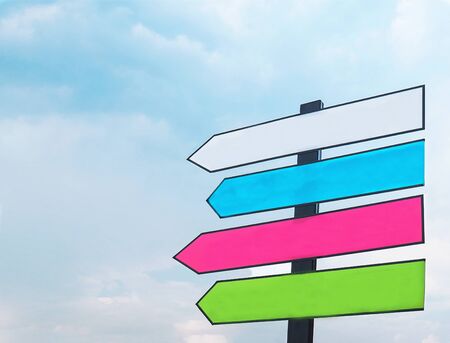 Colorful blank street direction sign with blue sky background