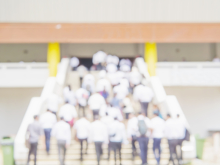 Blurred photo of crowded student is walking upstair to the examination hallの写真素材