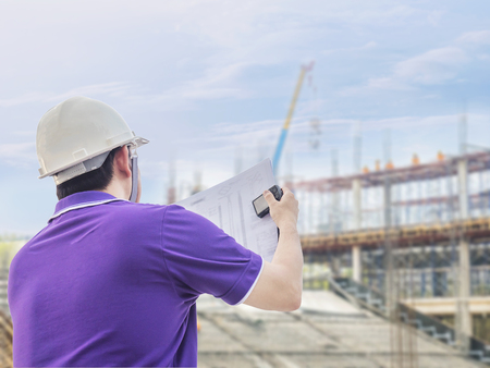 Engineer is inspecting his work in building construction site