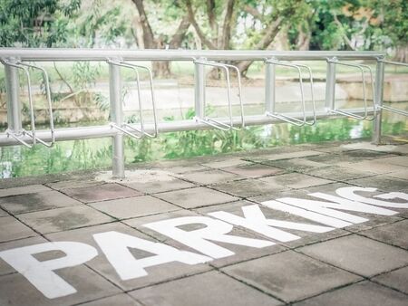 Vintage style photo of bicycle parking area in a campus, selective focusedの写真素材
