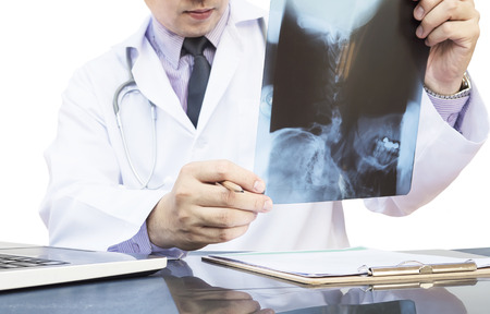 Male doctor is examined x-ray filmの写真素材